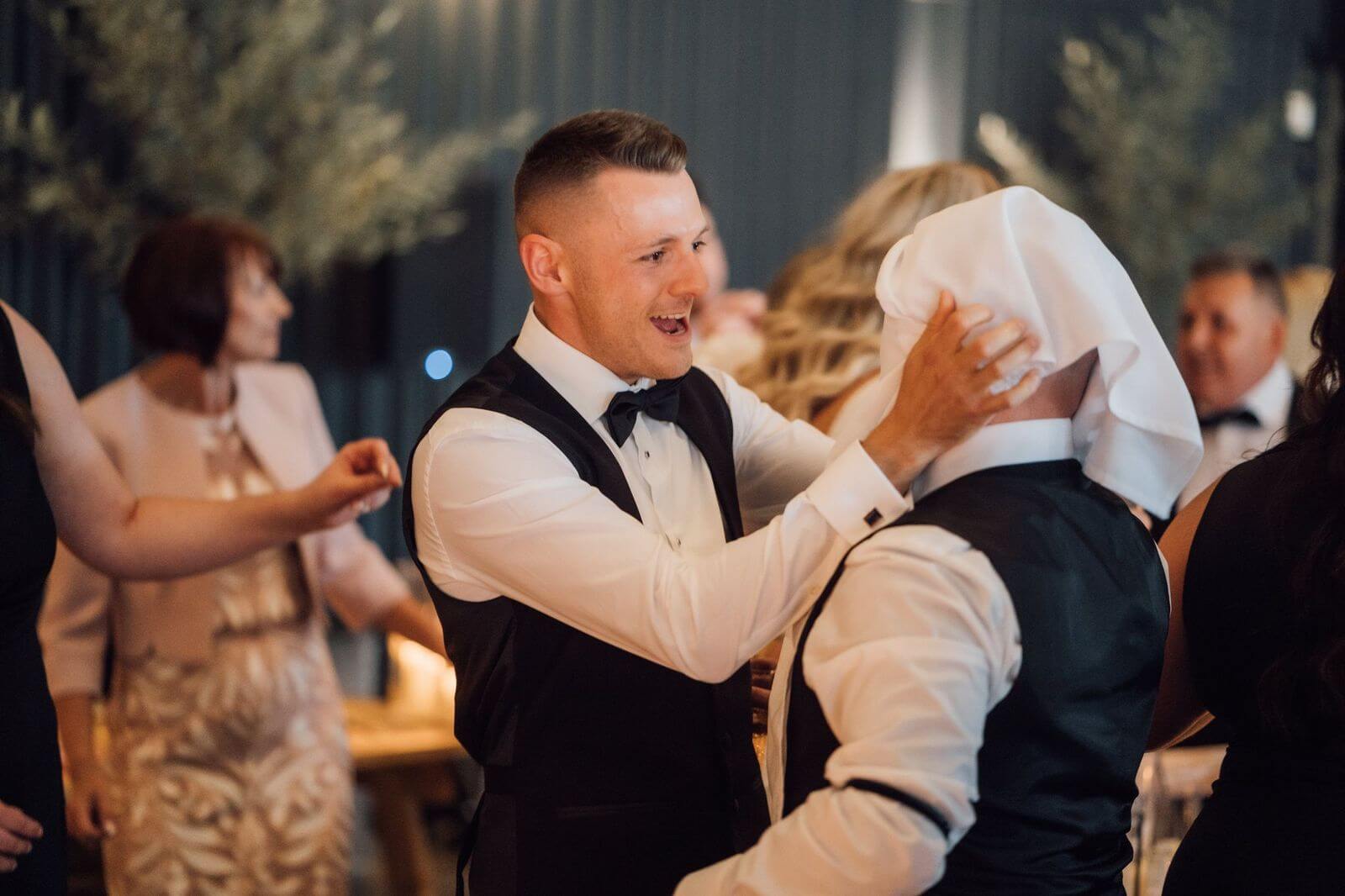 Wedding Guests reacting to Singing Waiters